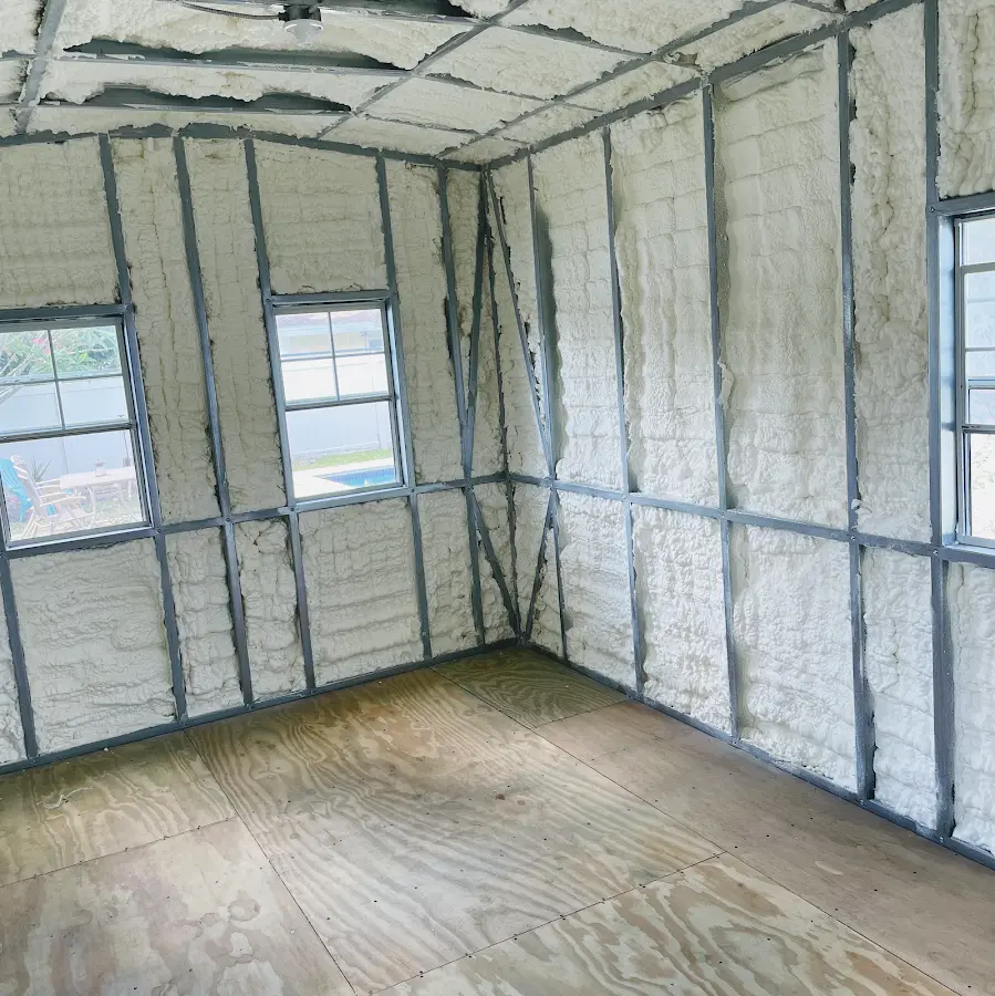 Closed-cell spray foam insulation applied to wall cavities in a residential project in Guilford